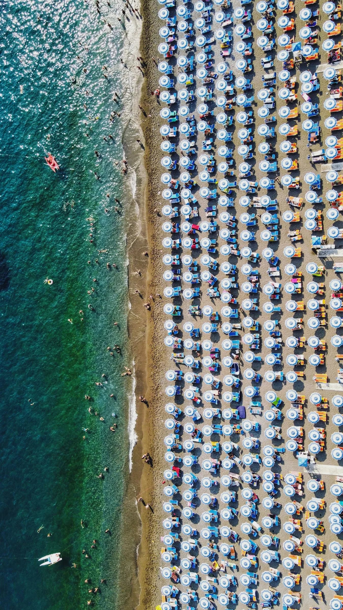 Spiaggia Grande from above: rows of umbrellas along the waterline