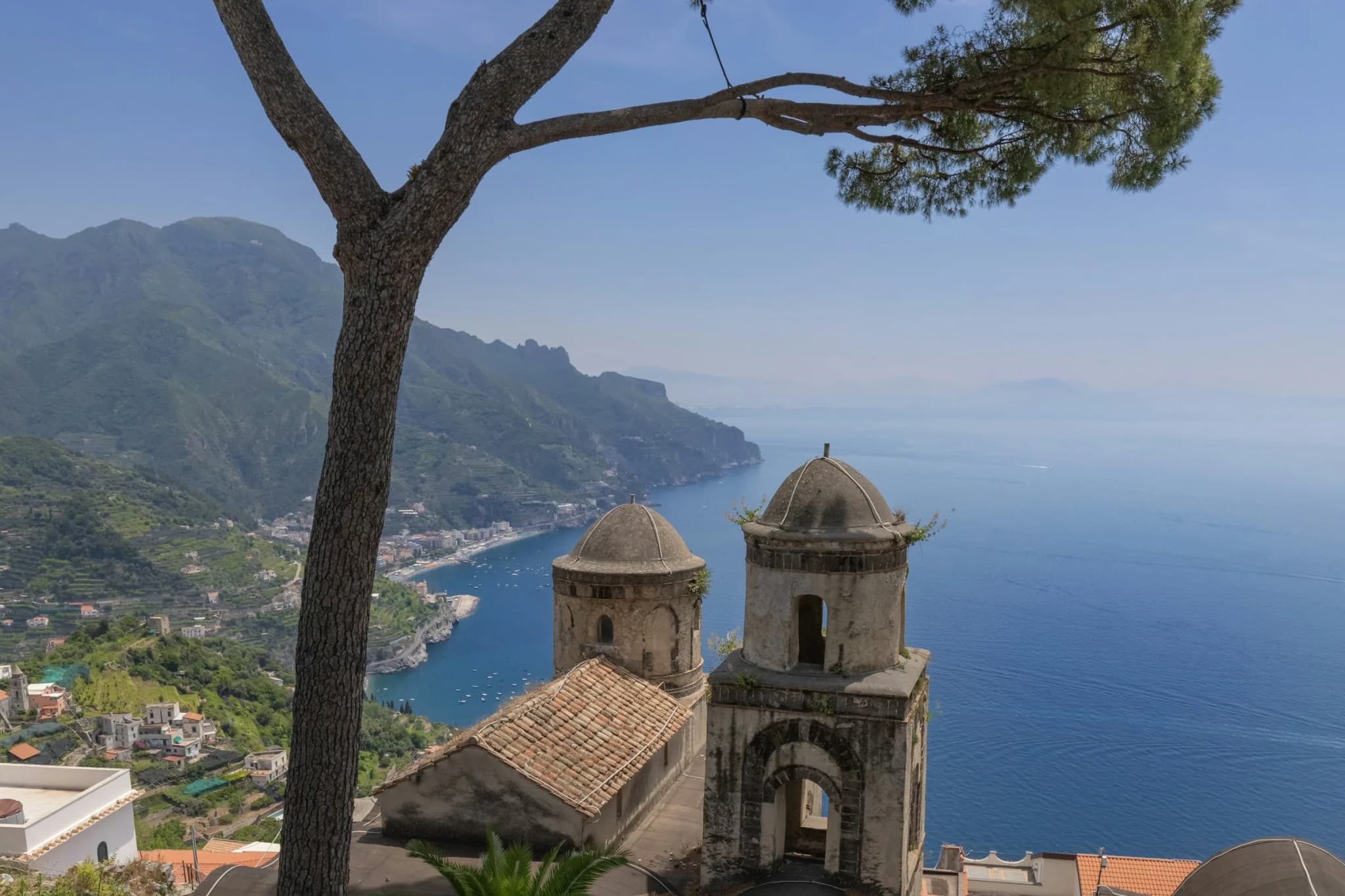The pine and the towers of Villa Rufolo above the coast in Ravello